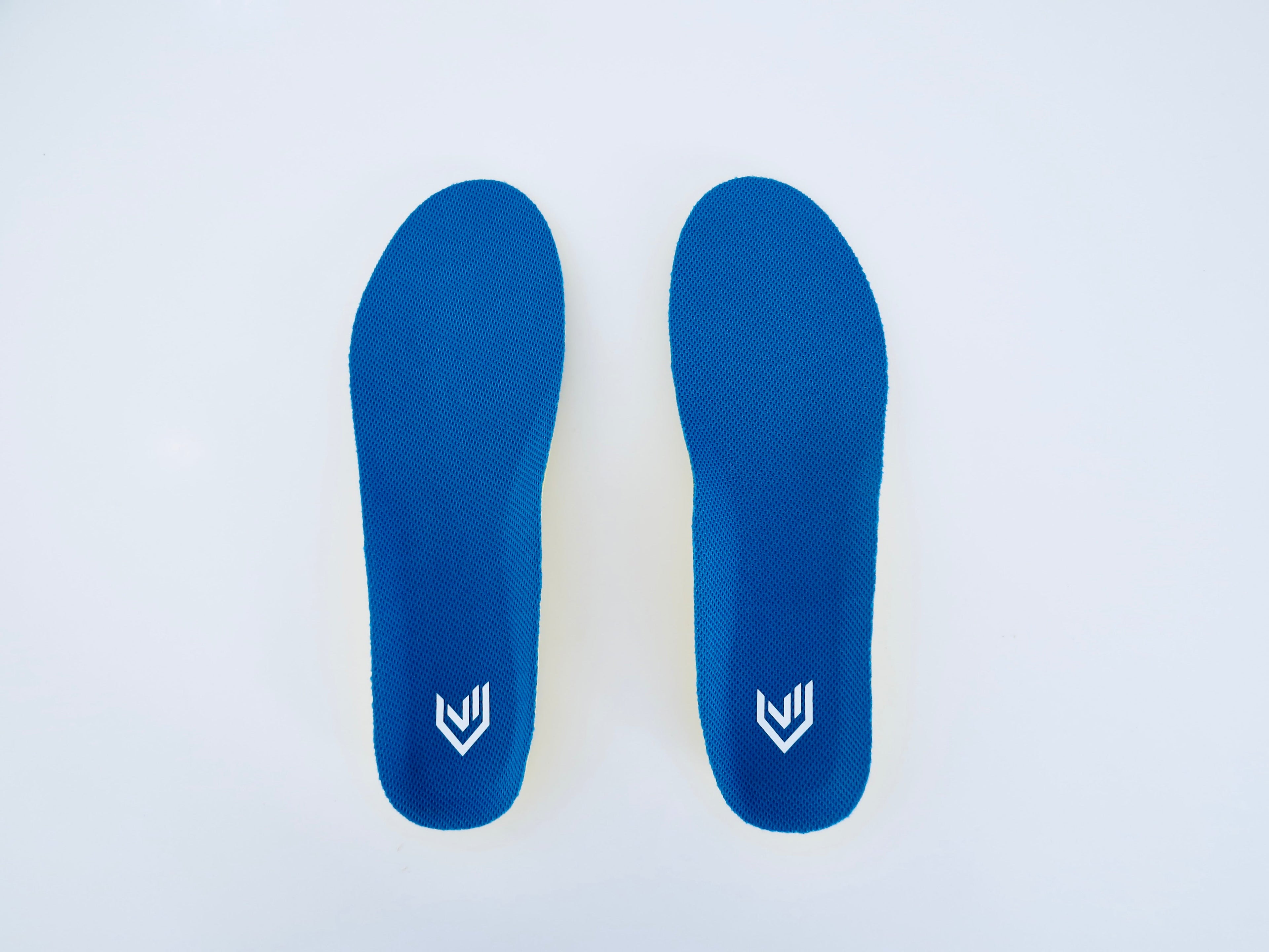 Speed V1 insole pair showing blue mesh top cover with white Stride Lab logo, flat lay on white background